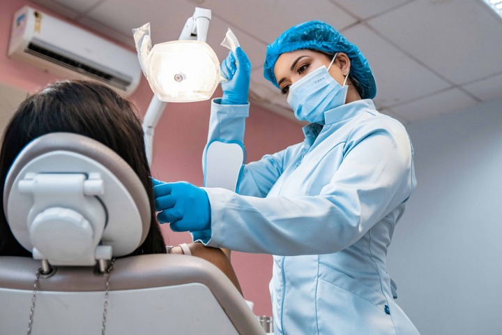 Dentist consulting with patient before starting restoration process